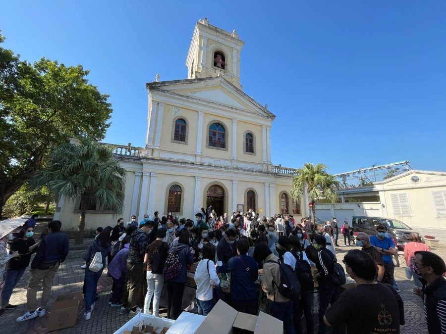 People outside the Mt Carmel Church in Taipa